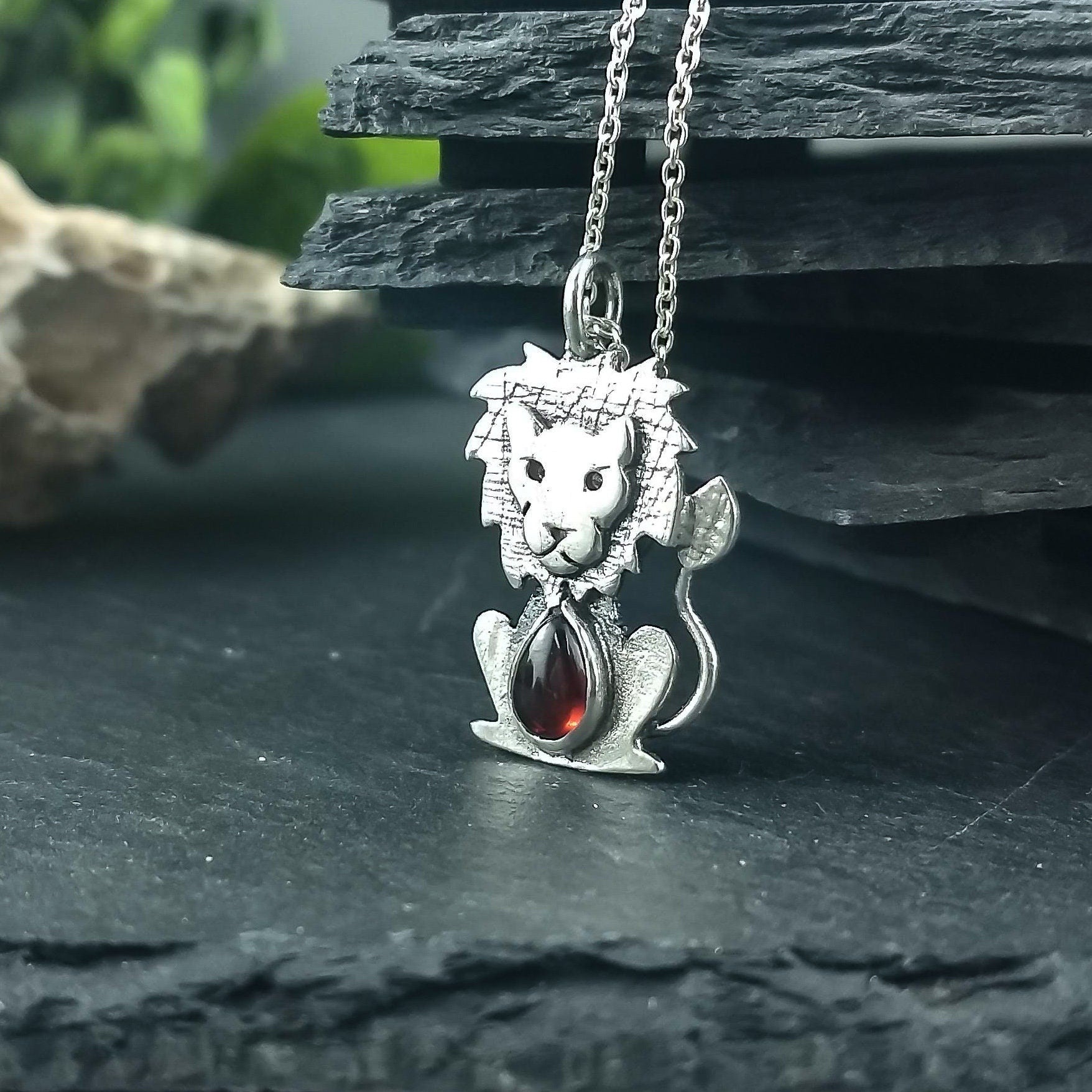 Sterling silver lion pendant with fine stone