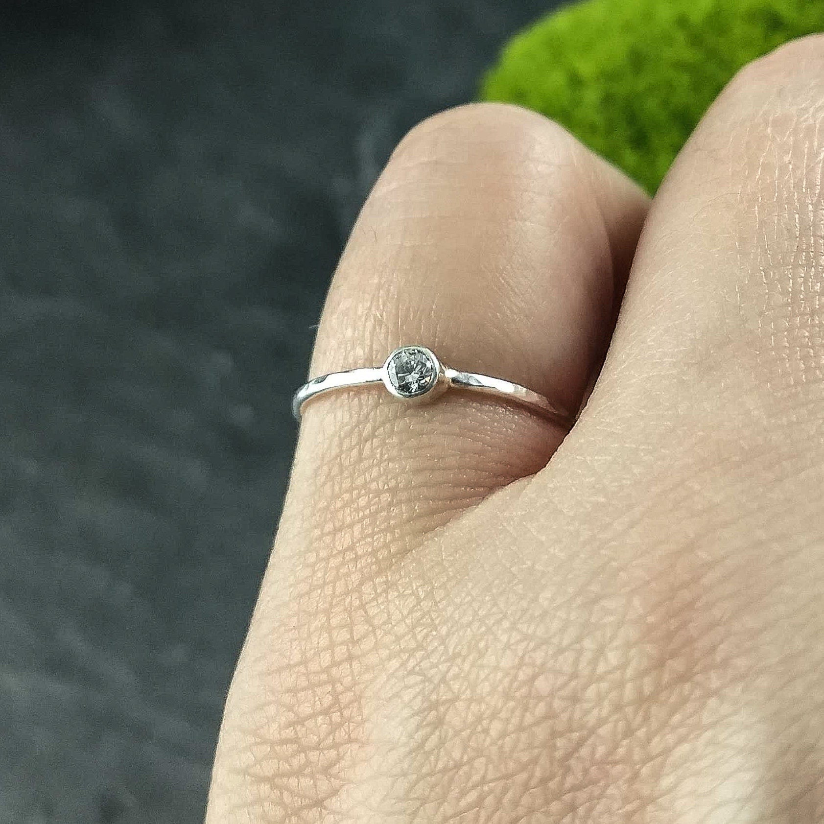 Thin hammered solitaire ring with fine stone in sterling silver